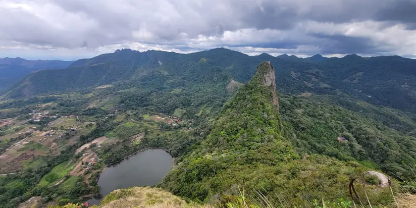 Green ridges and a lagoon seen from the summit