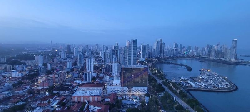 Panama City skyline across the bay, with fishing boats in the foreground
